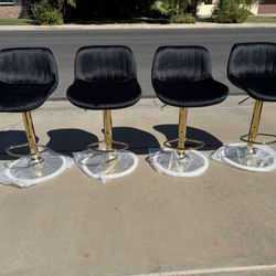 Black and gold adjustable barstools Only 85$ Each