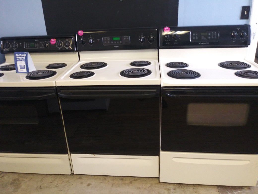 Beige and black 4 burner coil electric stove