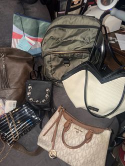17 Preowned and new bags,/purses,/backpacks , ETC… sizes Mini - Large all in great condition located off lake mead and Simmons area asking $25