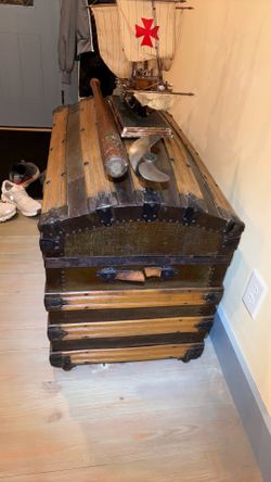 Vintage trunk and wood ship