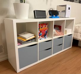 IKEA - KALLAX Shelving unit, with 2 doors/4 drawers white/light gray-blue wave shaped, 57 5/8x30 1/8 "