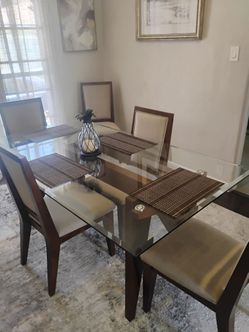 Tommy Bahama glass dining room table six chairs only 1 years old