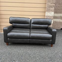 Double sofa. Leather sofa in chocolate color. Sofa bed