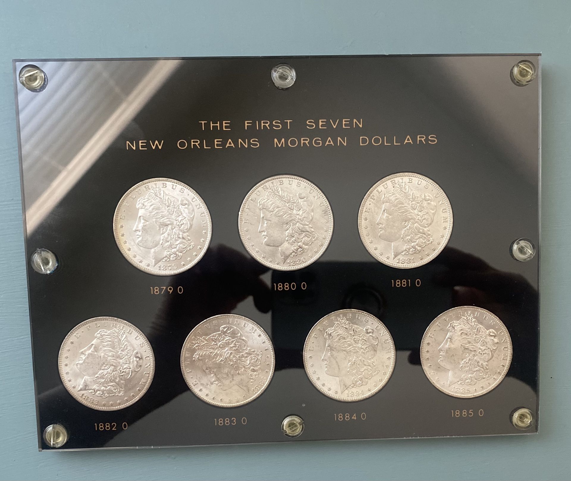 The First Seven Morgan New Orleans Silver Dollars.