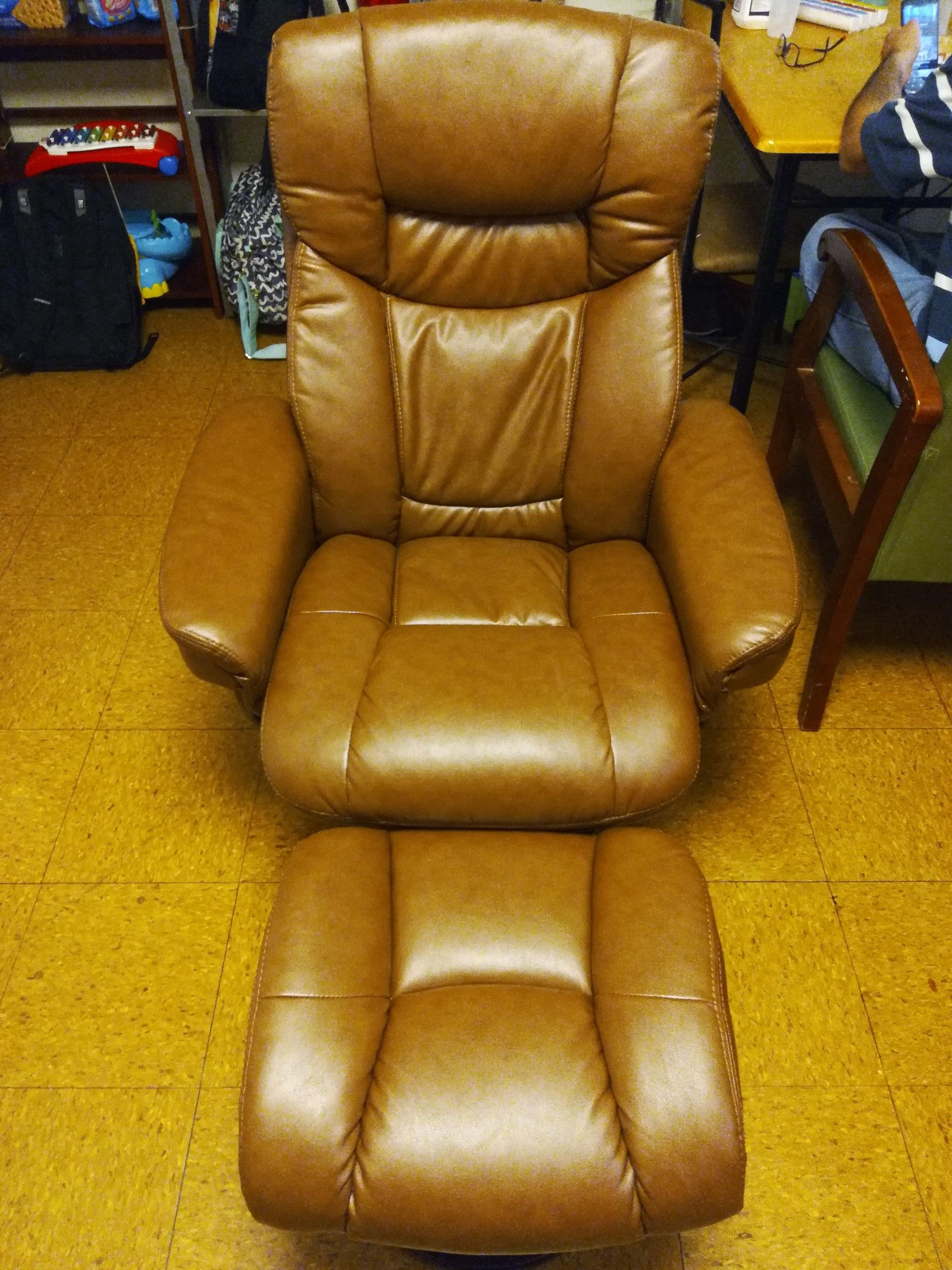 Leather swivel recliner with ottoman