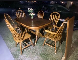 Dining table with six chairs and good condition and sturdy with a extra piece to make it bigger.