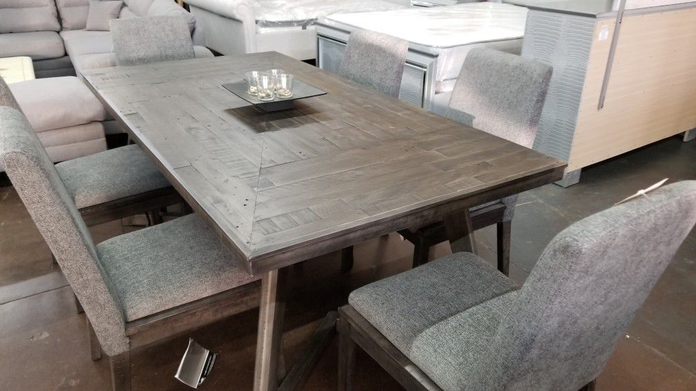 Top of the line Ashley rustic grey dining table with 6 chairs