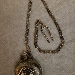 Rolling Stones Pocket Watch With Clip, Quartz Movement,  Licensed 2008.Chain As Couple Spots Of Rust and the tin box lid. East, west, north
