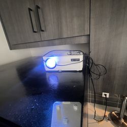 Projector , Couch , 35 Inc Roku Tv