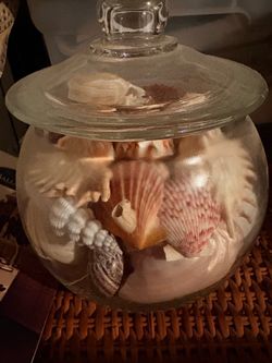 Glass jar with shells decor