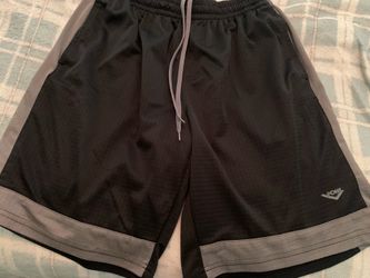 Men’s Pony brand basketball shorts size XL with two front pockets and gray accent stripes.