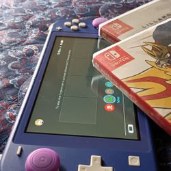 Switch Lite WITH 2 games . FIRM deal