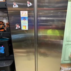 Samsung 28 cubic foot  stainless refrigerator freezer side by side.