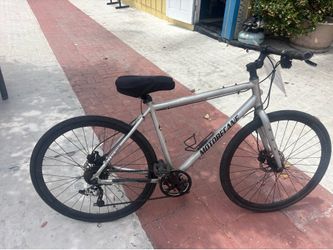 Motobecane  bicycle hybrid eight speed , with disc brakes good condition call (contact info removed)
