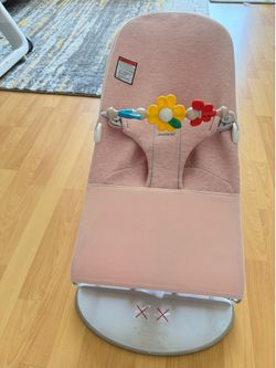 Björn Bouncer Bliss, Light Pink,Newborn to Toddler (8-29 lbs), with a toy