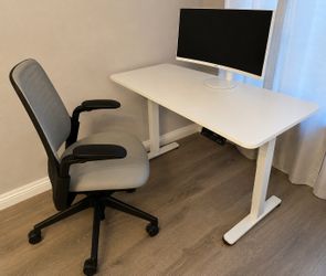 Steelcase chair and white motorized desk