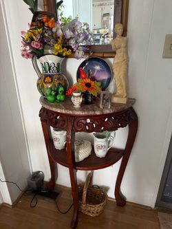 A decorative carved wood base