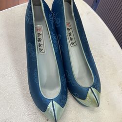 Blue Subok Kkoshin blue embroidered shoes are traditional Korean "flower shoes" known as hwahye, designed to be worn with hanbok