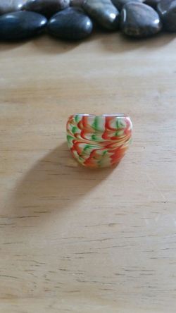 Green, orange, and white glass ring