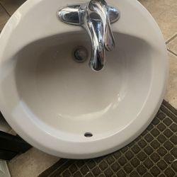 White sink with Faucet And New Cords
