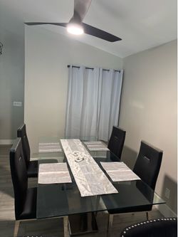 Glass and Chrome Dining Room Table w/ 4 Black Leather and Chrome  Chairs
