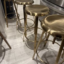 4  GOLD COLOR BAR/ ISLAND  SITTING STOOLS