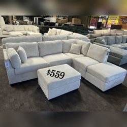 Beige corduroy reversible sectional sofa with ottoman