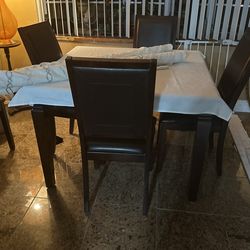 Table with six chairs setting  