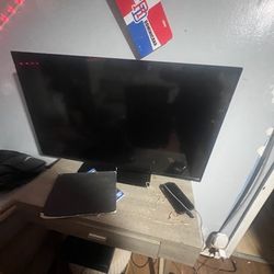Tv, Desk, PS4, And Couch/place To Store Clothes 