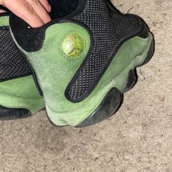 beat up jordan 13’s olive green color way