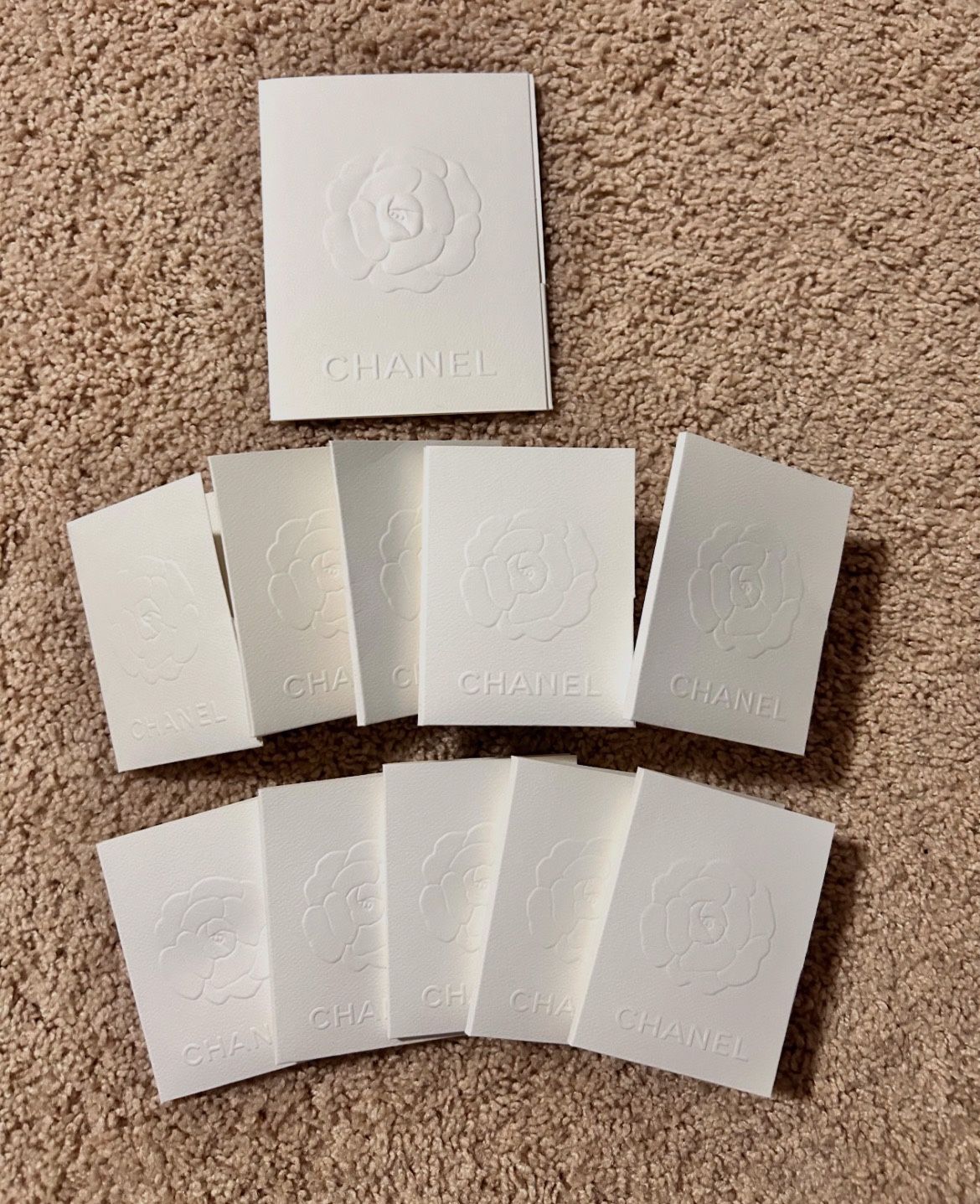 Chanel Camellia Embossed receipt holders. 11 pc