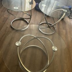	“3-Piece Glass Table Set — modern design with chrome base. Great condition! Perfect for living room or lounge area. 