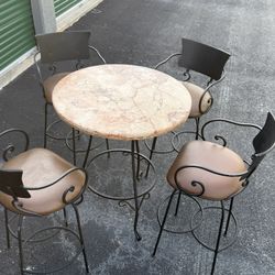 Wrought Iron, Marble Top Table With Four Swivel Bar Stools. 
