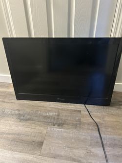 Emerson 32in TV with brackets for wall mount, but no wall mount included