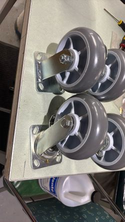 heavy-duty swivel caster wheel with a brake mechanism and a gray thermoplastic rubber