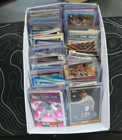 Box full of random baseball Pokémon basketball and football cards