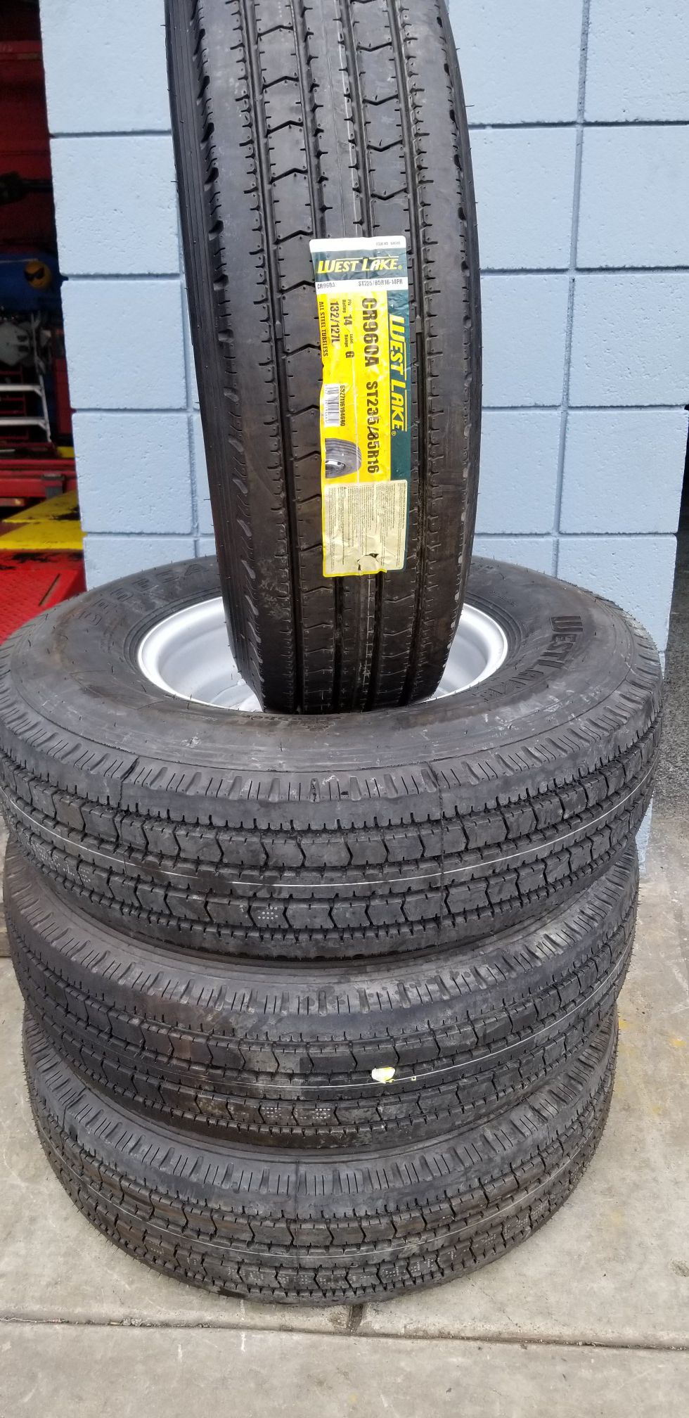 235/85R16 H/D 14 ply trailer tire and rim package