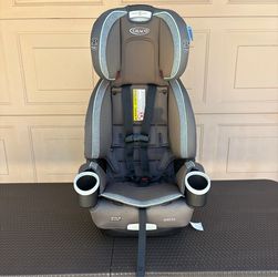 Gray Graco 4Ever DLX 4-in-1 Car Seat with built-in dual cup holders and a five-point harness system