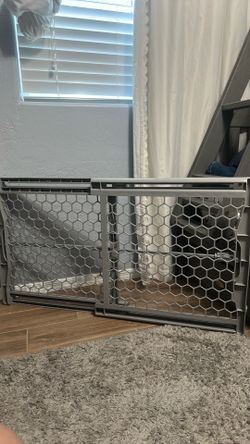 gray, plastic expandable pet gate
