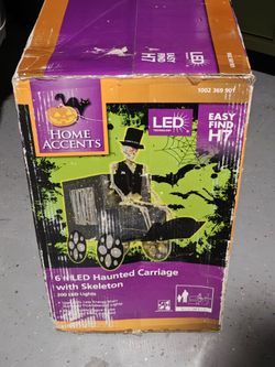 Home accents home Depot 6 ft led carriage with skeleton
