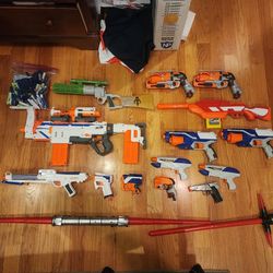 Assorted Nerf Guns And Star Wars Weapons