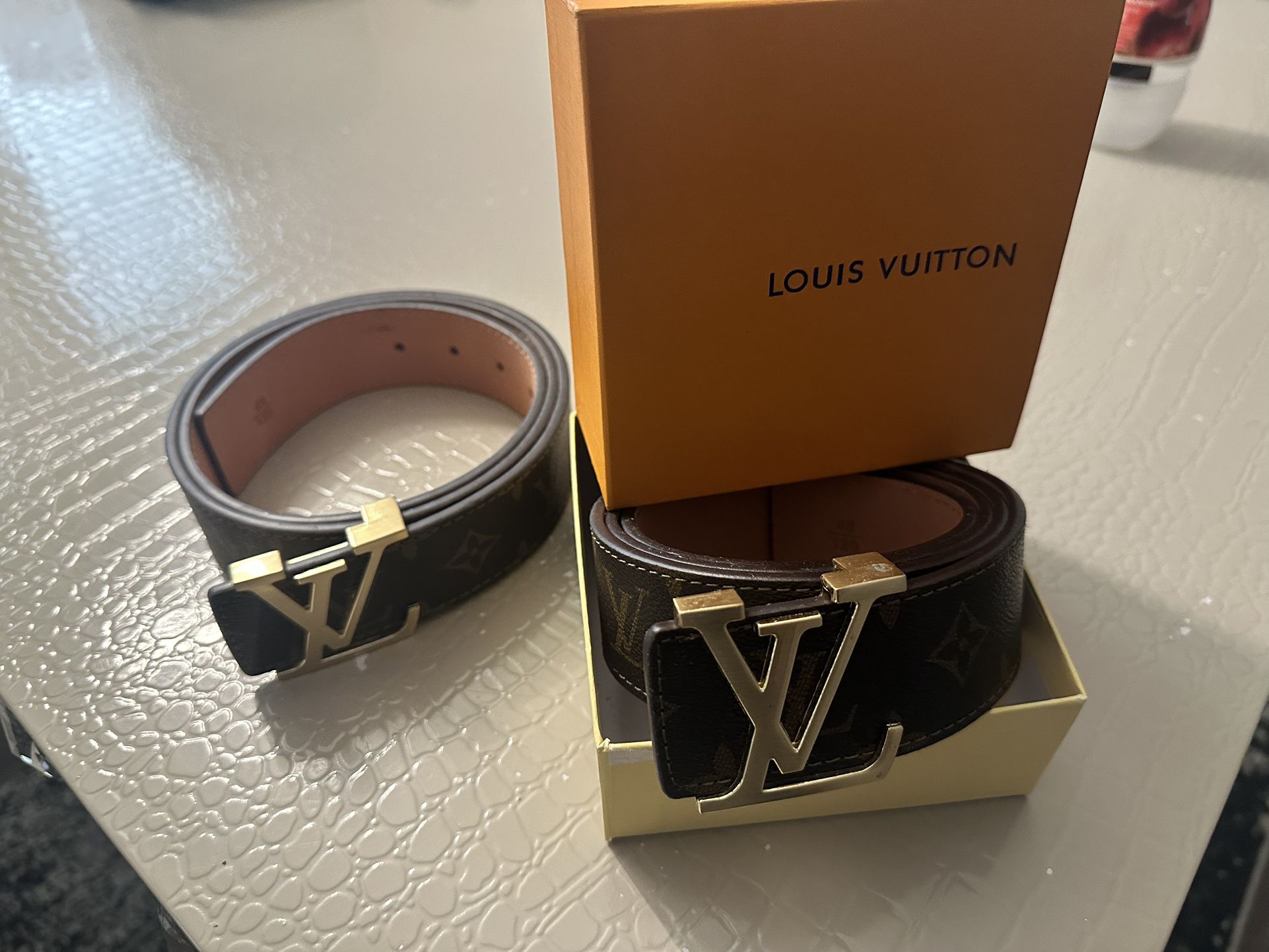 Gray and black Leather Louis Vuitton Belt. Size 44/110. This will fit a  waist size from 32 to 36 for Sale in Fort Stewart, GA - OfferUp