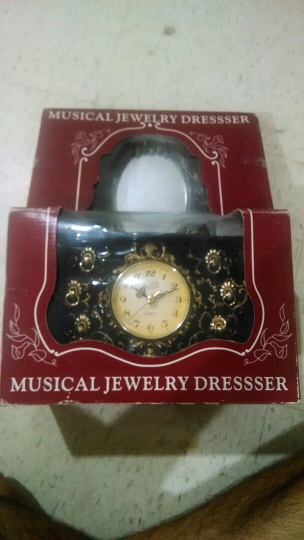 Musical jewelry dresser with clock