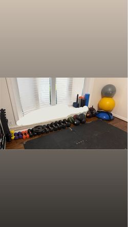 Assorted dumbells, kettle bells and gym equipment