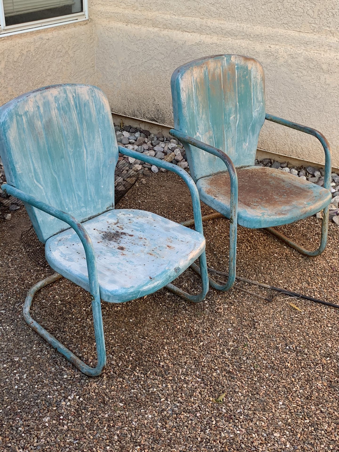 Antique metal land chairs pair