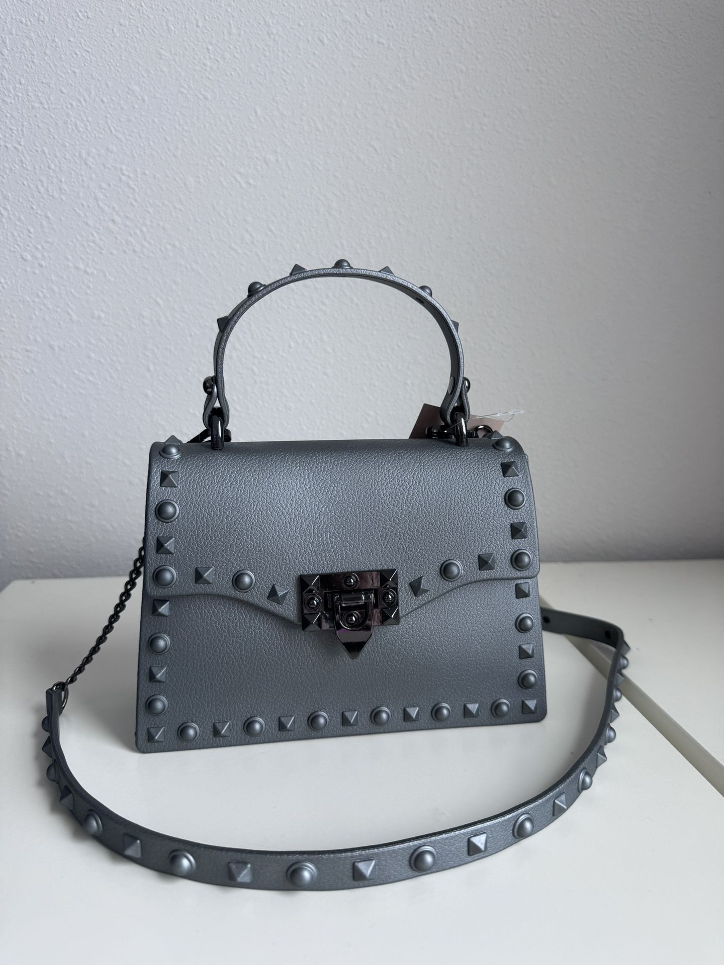 Rockstud Spike Silver Crossbody Rubber Handbag. Removable Strap. Water Resistant Material. New, Never Used.