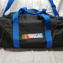Nascar black and blue durable duffle bag. Duffle bag has handles on top or you can use the padded  shoulder strap. Duffle bag is preowned in good cond
