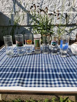 7 assorted tall shot glasses