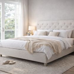 Queen Upholstered Bed Frame:This queen bed frame features full upholstery in a soft, textured fabric, creating a cozy and relaxed atmosphere suitable 
