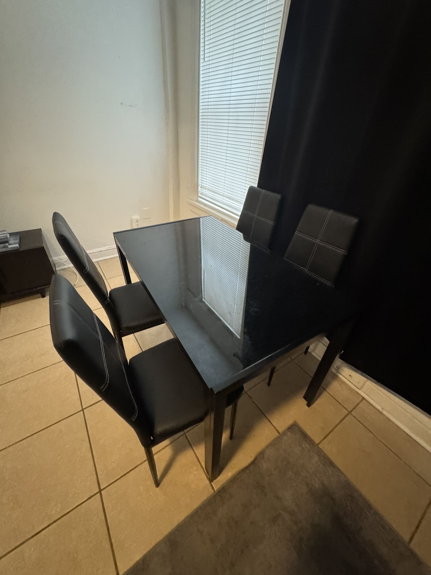 Black table with four chairs